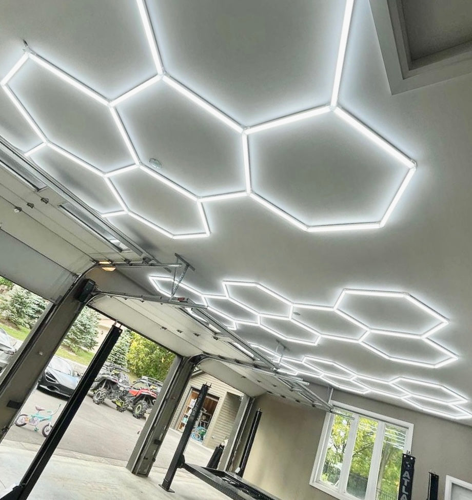 Custom unique hexagon lighting kits installed in 3 car garage