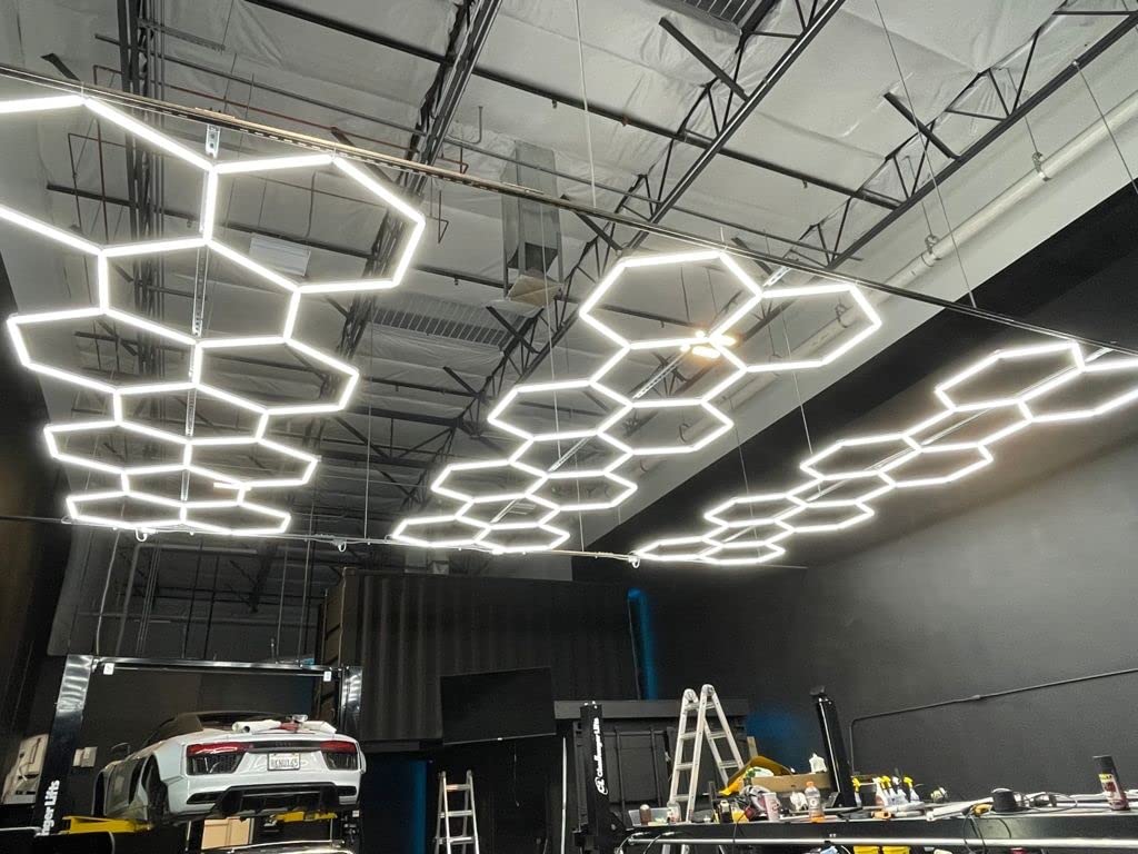 Hexagon LED lighting suspended in luxury auto garage