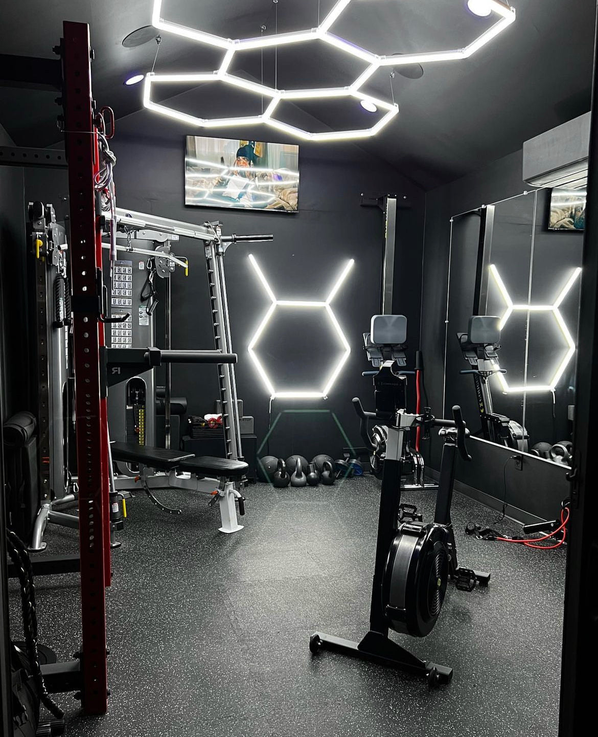 Home gym with custom hexagon LED lighting