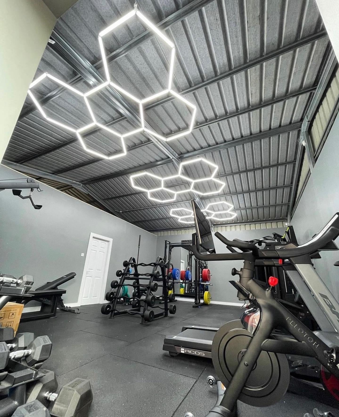 Home gym with custom hexagon LED lighting